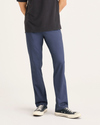 Front view of model wearing Crown Blue Men's Slim Fit Original Chino Pants.