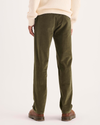 Back view of model wearing Dark Moss Ultimate Chino Pants with Smart 360 Flex™, Slim Fit.