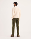 Back view of model wearing Dark Moss Ultimate Chino Pants with Smart 360 Flex™, Slim Fit.