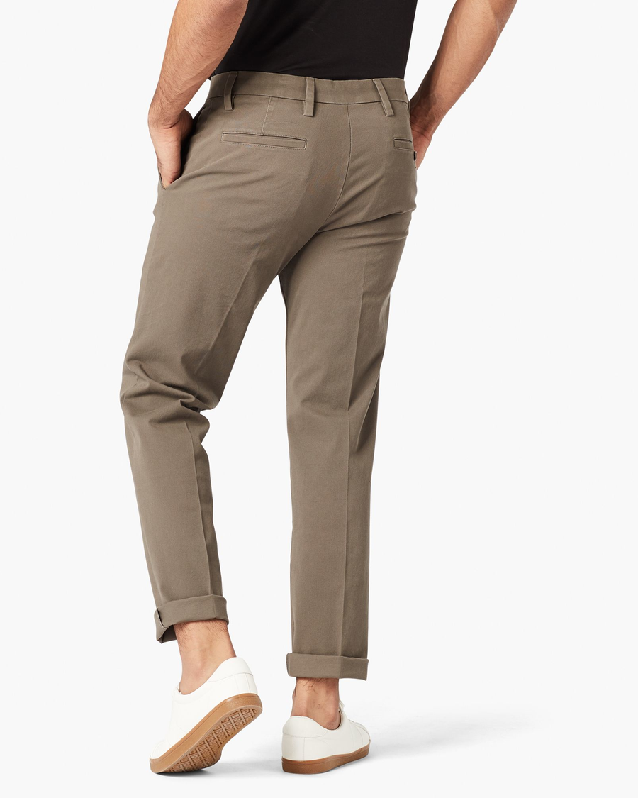 Back view of model wearing Dark Pebble Workday Khaki Pants, Slim Fit.