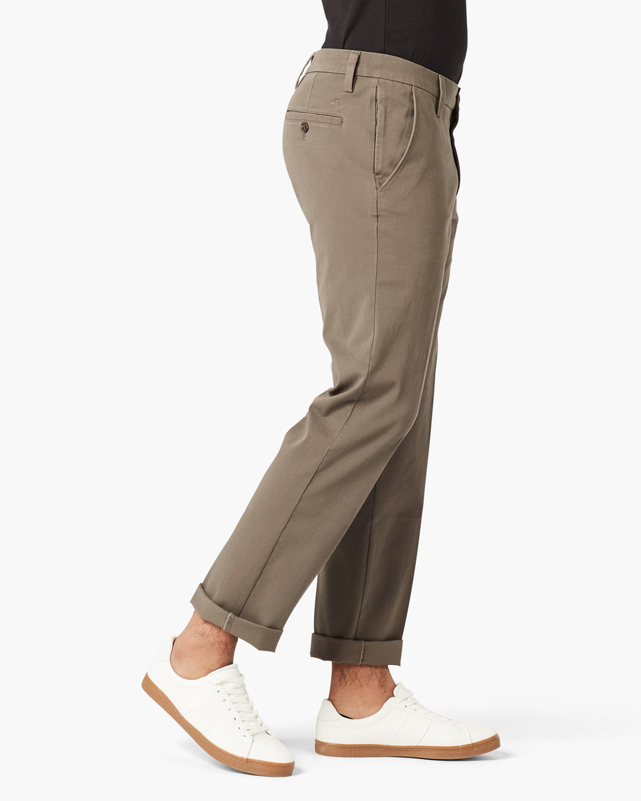 Side view of model wearing Dark Pebble Workday Khaki Pants, Slim Fit.