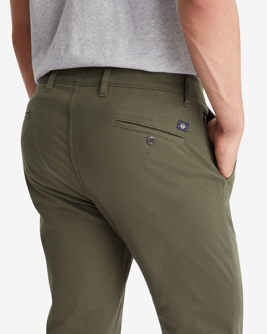 View of model wearing Deep Depths Men's Skinny Fit Supreme Flex Alpha Khaki Pants.