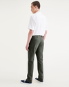 Back view of model wearing Deep Forest Men's Slim Fit Smart 360 Flex California Chino Pants.