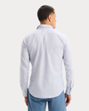 Back view of model wearing Deep Ultramarine Icon Button Up Shirt, Slim Fit.
