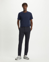 Front view of model wearing Dockers Navy Crafted Khaki Pants, Slim Tapered Fit.