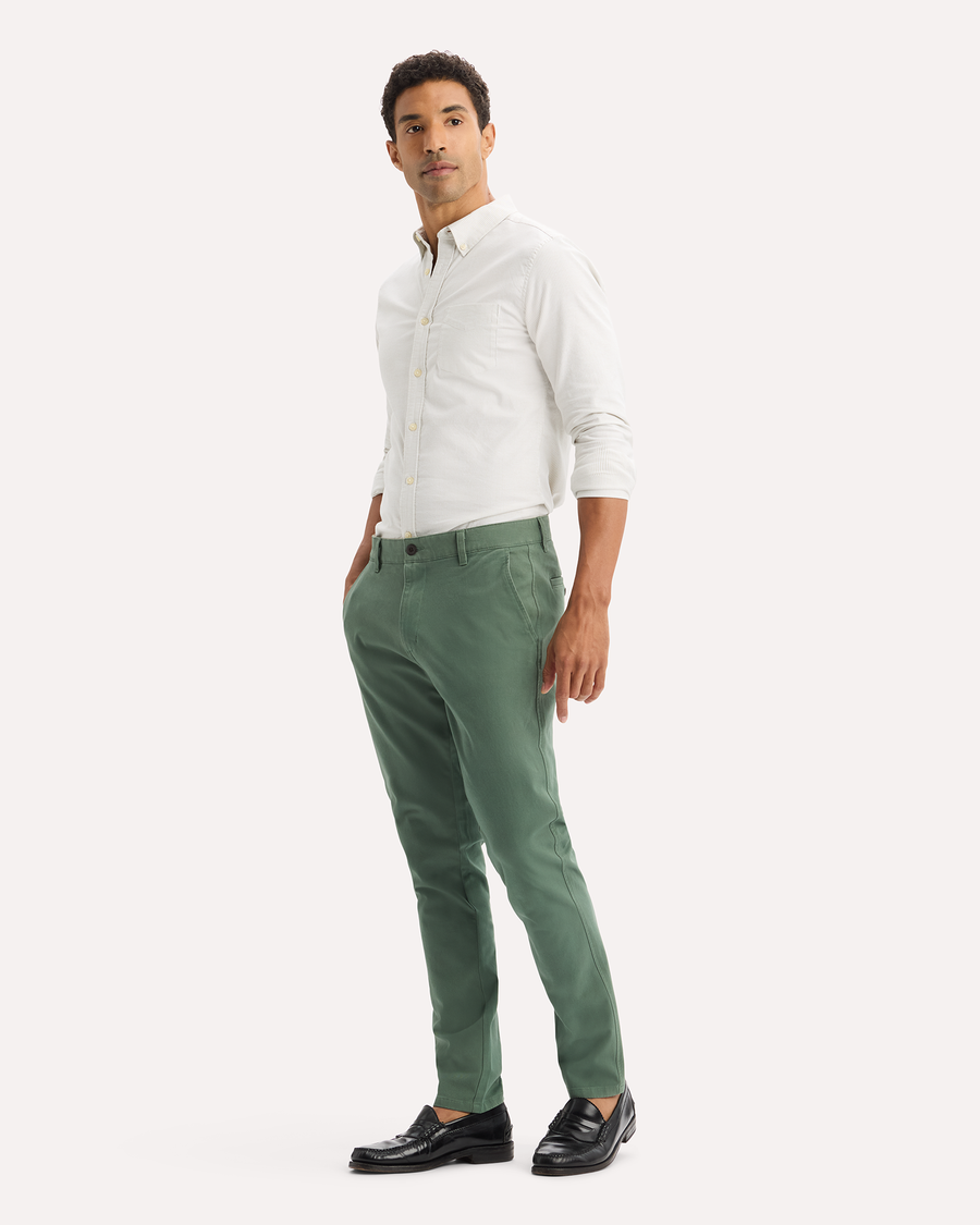 View of model wearing Duck Green Ultimate Chinos, Skinny Fit.