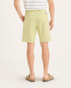Back view of model wearing Dusty Yellow Alpha Chino Shorts, Straight Fit.