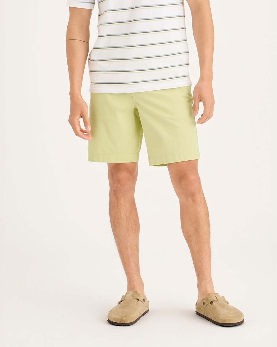 Front view of model wearing Dusty Yellow Alpha Chino Shorts, Straight Fit.