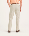 Back view of model wearing Dusty Yellow Men's Slim Fit Smart 360 Flex Ultimate Chino Pants.