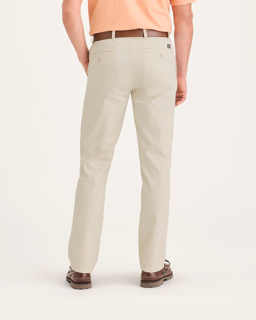 Back view of model wearing Dusty Yellow Men's Slim Fit Smart 360 Flex Ultimate Chino Pants.