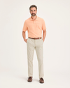 Front view of model wearing Dusty Yellow Men's Slim Fit Smart 360 Flex Ultimate Chino Pants.