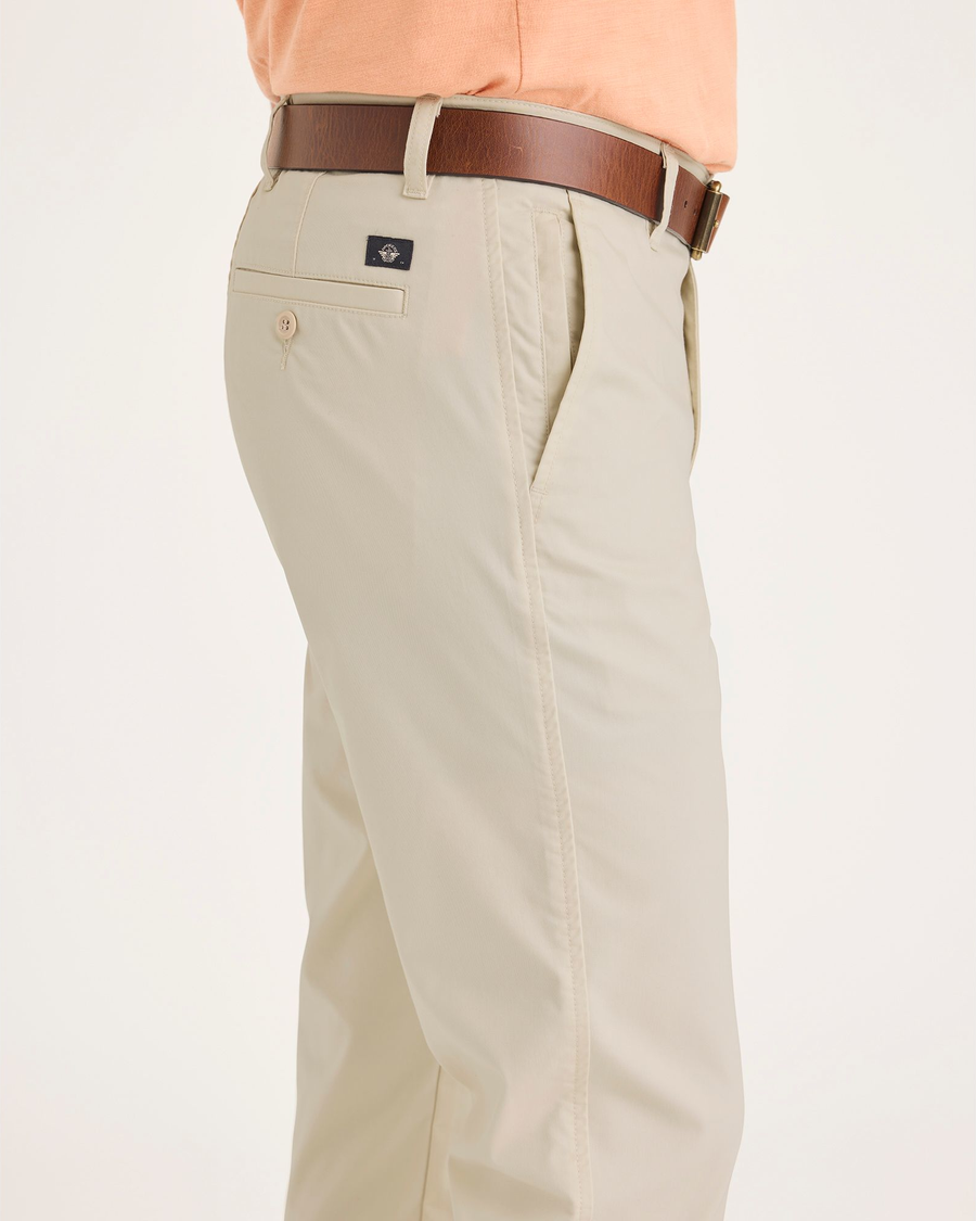 Side view of model wearing Dusty Yellow Men's Slim Fit Smart 360 Flex Ultimate Chino Pants.