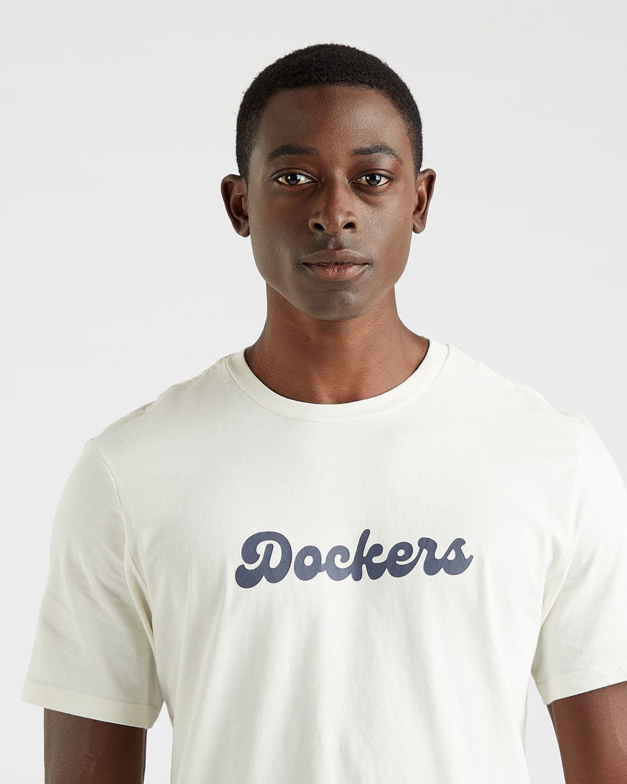 View of model wearing Egret Men's Slim Fit Logo Tee.