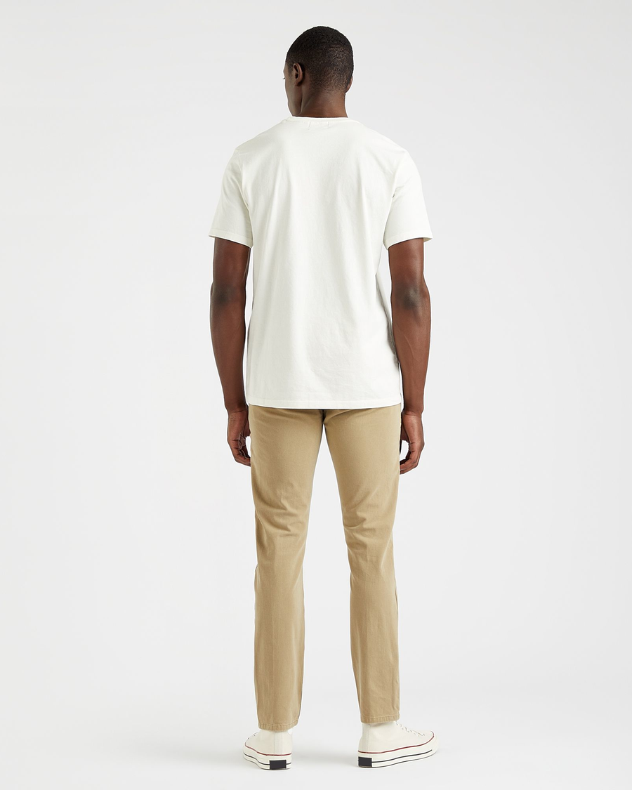 Back view of model wearing Egret Men's Slim Fit Logo Tee.