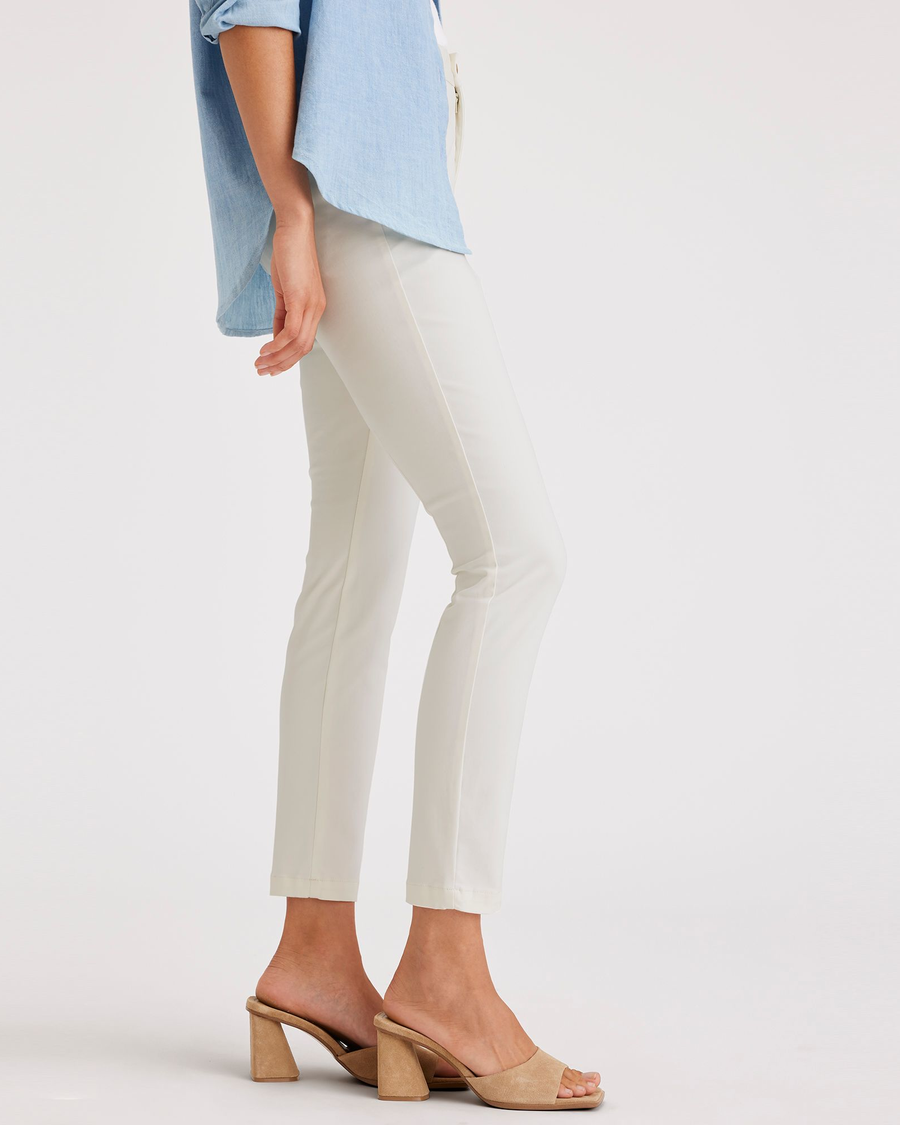 Side view of model wearing Egret Women's Skinny Fit Chino Pants.