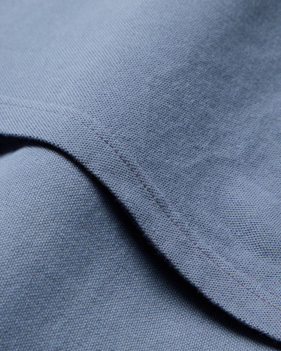 View of model wearing Folkstone Gray Pique Polo, Slim Fit.