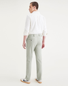 Back view of model wearing Forest Fog Men's Slim Fit Supreme Flex Alpha Khaki Pants.
