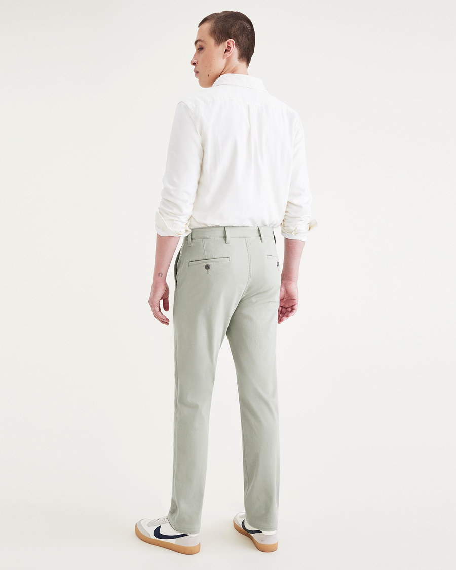 Back view of model wearing Forest Fog Men's Slim Fit Supreme Flex Alpha Khaki Pants.