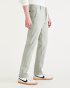 Side view of model wearing Forest Fog Men's Slim Fit Supreme Flex Alpha Khaki Pants.