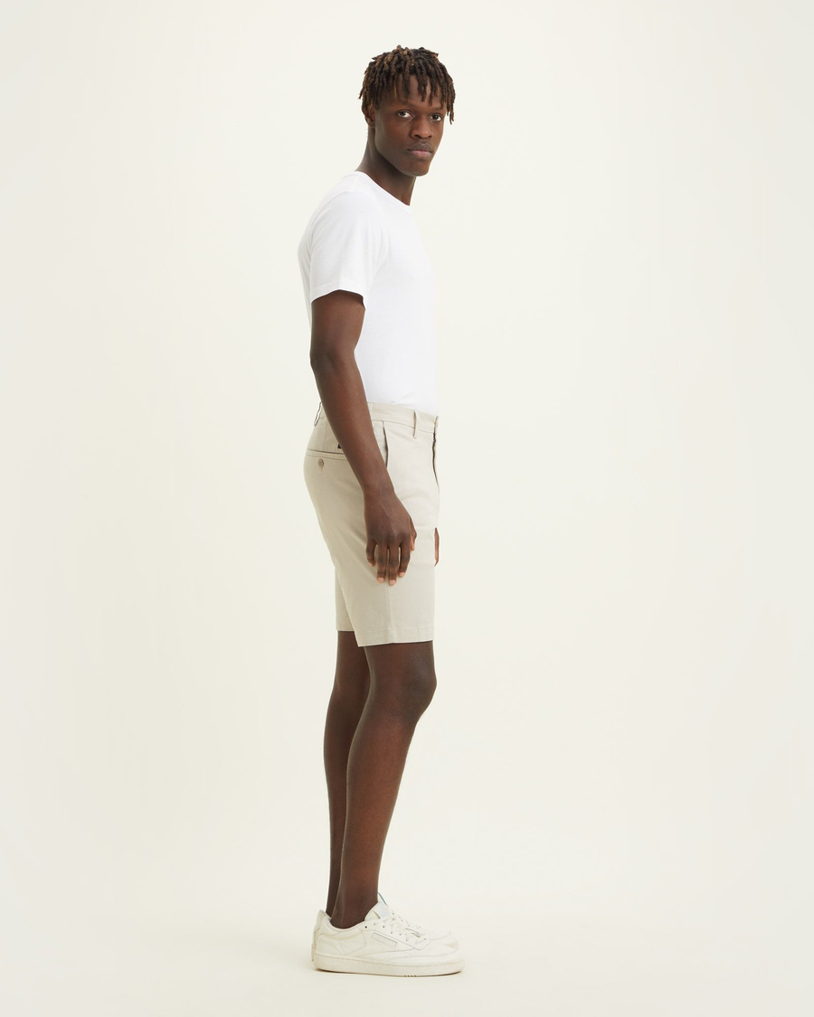 Side view of model wearing Grit Men's Supreme Flex Modern Chino Short.