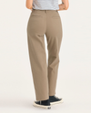 Back view of model wearing Harvest Gold Blake Chino Pants, High Straight Fit.