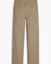 View of model wearing Harvest Gold Eighty-Six Utility Pants, Loose Fit.