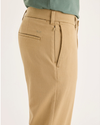 Side view of model wearing Harvest Gold Go Activeflex Chino, Slim Fit.