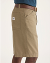 Side view of model wearing Harvest Gold Men's Loose Fit Eighty-Six Dock 10" Shorts.