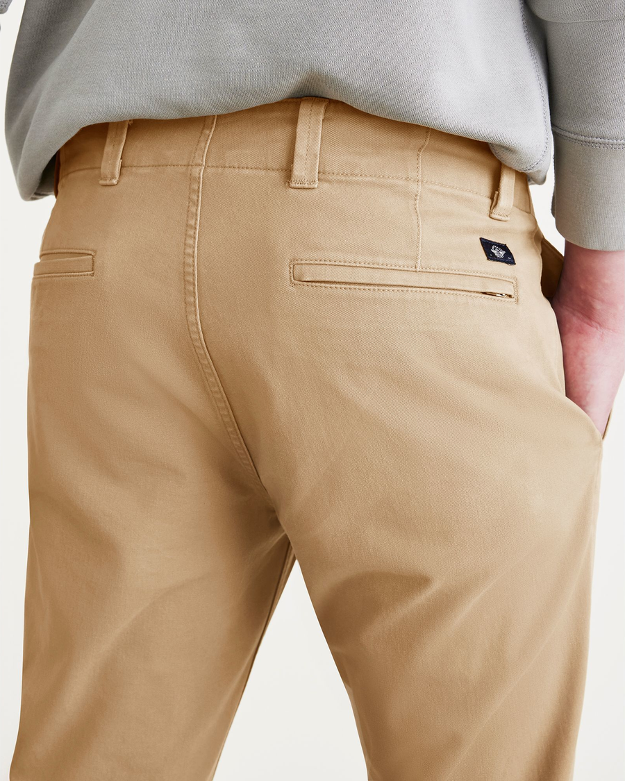 View of model wearing Harvest Gold Men's Skinny Fit Smart 360 Flex California Chino Pants.