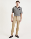 Front view of model wearing Harvest Gold Men's Slim Fit Original Chino Pants.