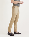 Side view of model wearing Harvest Gold Men's Slim Fit Original Chino Pants.