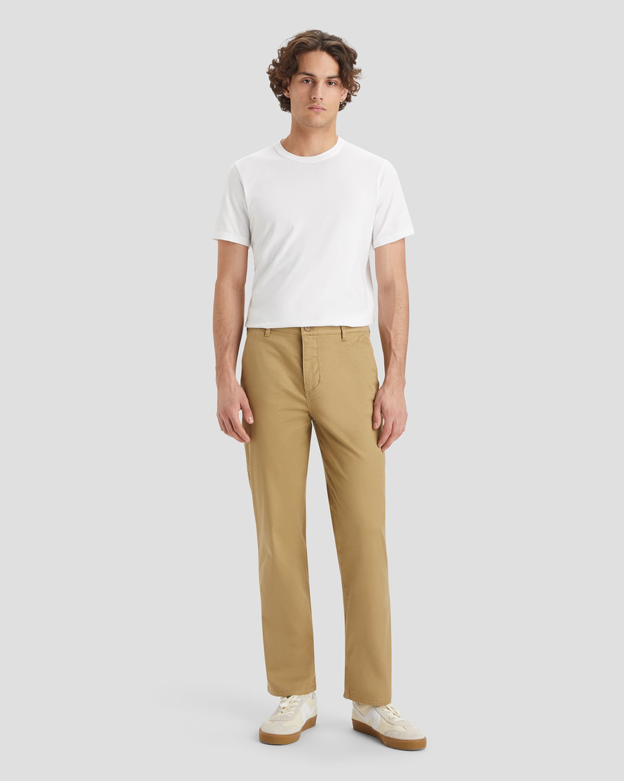 Front view of model wearing Harvest Gold Men's Straight Fit Original Chino Pants.