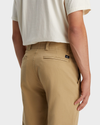 View of model wearing Harvest Gold Men's Straight Fit Smart 360 Flex California Chino Pants.