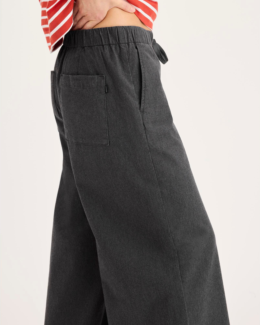 Side view of model wearing Heather Gray Drawstring Pants.