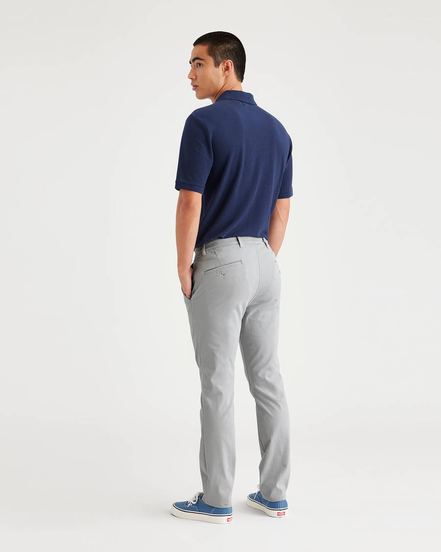 Back view of model wearing High-Rise Men's Skinny Fit Supreme Flex Alpha Khaki Pants.
