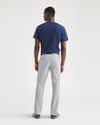 Back view of model wearing High-Rise Men's Slim Fit Smart 360 Flex Alpha Chino Pants.