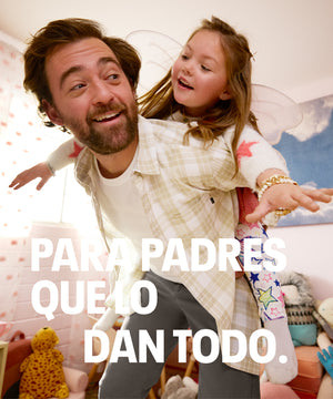 Dad holding child while wearing Dockers® Dad Pants, highlighting comfort and flexibility for parenting moments.