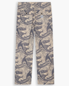 View of model wearing Ichabod Buttercream Eighty-Six Utility Pants, Loose Fit.