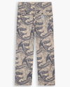 View of model wearing Ichabod Buttercream Eighty-Six Utility Pants, Loose Fit.