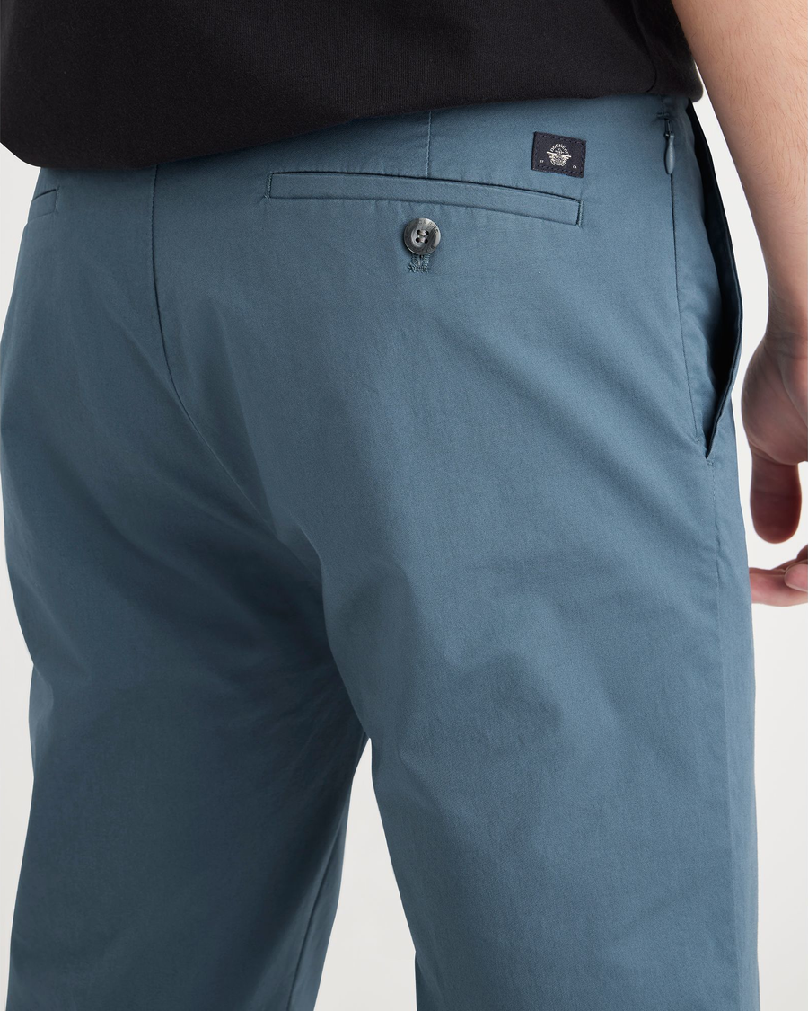 View of model wearing Indian Teal Men's Slim Fit Smart 360 Flex Alpha Chino Pants.