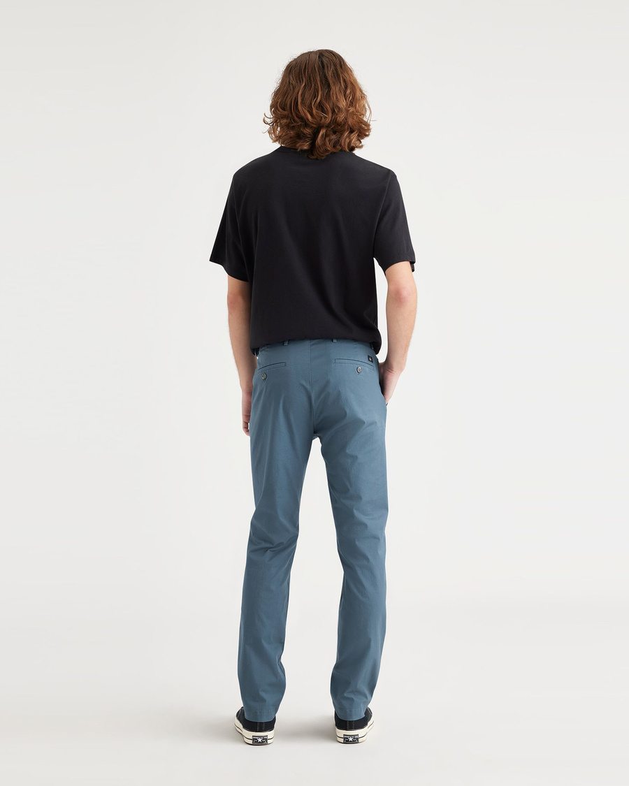 Back view of model wearing Indian Teal Men's Slim Fit Smart 360 Flex Alpha Chino Pants.