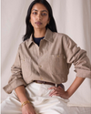 View of model wearing Khaki Chambray Dockers® x Transnomadica Dock Shirt.