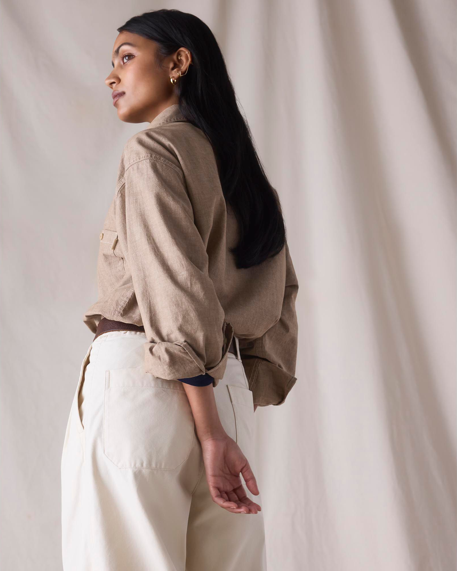 Back view of model wearing Khaki Chambray Dockers® x Transnomadica Dock Shirt.
