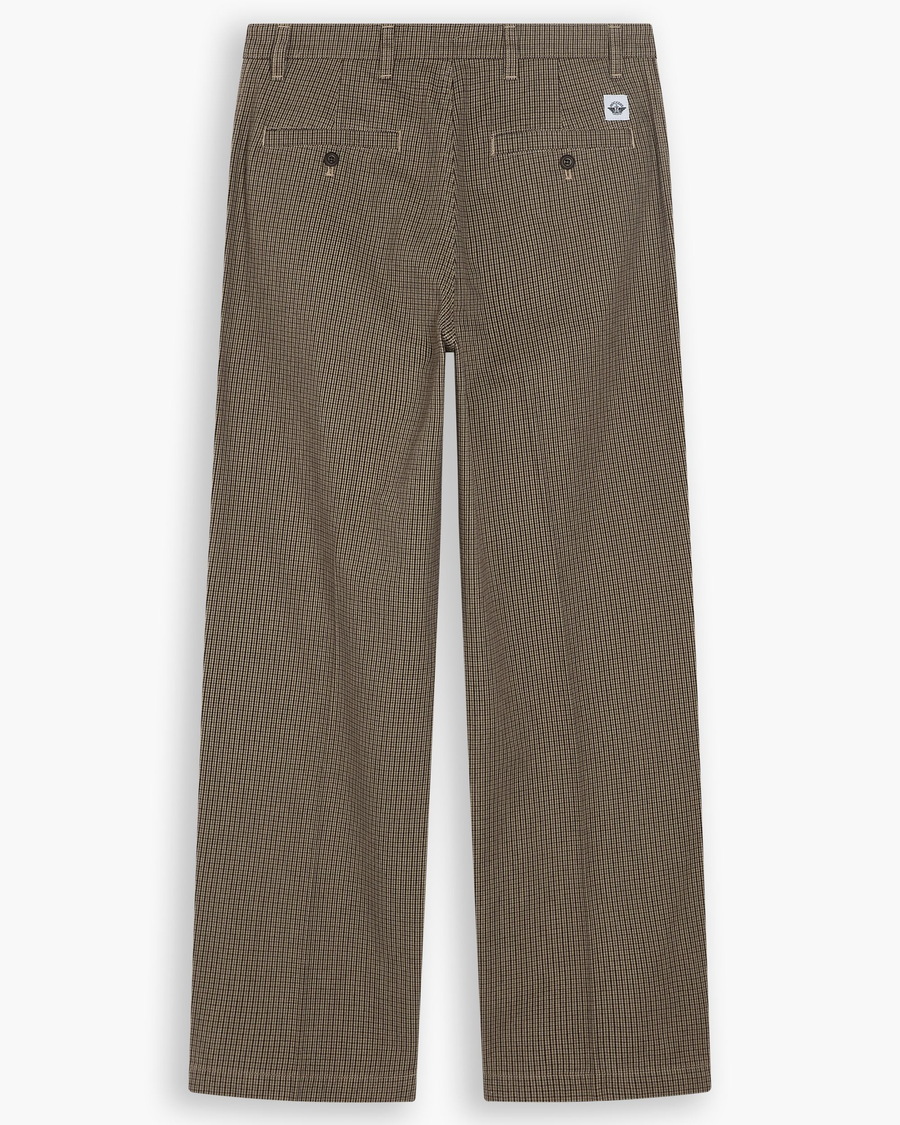 View of model wearing Lemon Pepper Eighty-Six Original Pleated Chinos, Loose Fit.