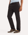 Side view of model wearing Licorice Original Chino Pants, Slim Fit.