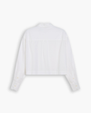 View of model wearing Lucent White Boxy Cropped Shirt, Relaxed Fit.