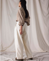 Back view of model wearing Lucent White Dockers® x Transnomadica Rigger Pant.
