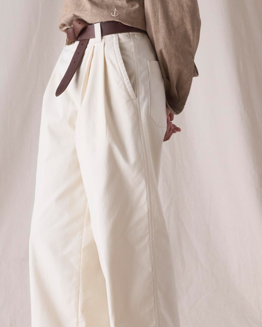 Side view of model wearing Lucent White Dockers® x Transnomadica Rigger Pant.