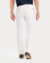 Back view of model wearing Lucent White Original Chino Pants, Slim Fit.