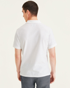 Back view of model wearing Lucent White Pique Polo, Slim Fit.